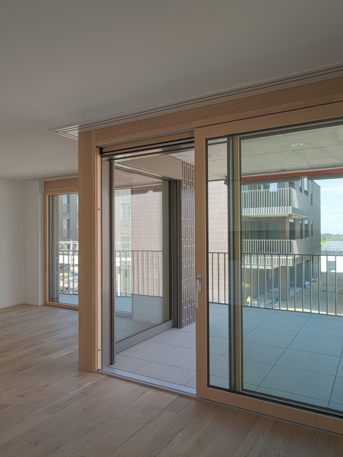 Vue depuis un logement du projet Panorama, Bussigny, paysage environnant en arrière-plan